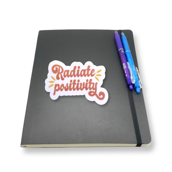 "Radiate Positivity" Vinyl Die cut Decal Sticker On Black Journal